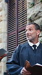 Man, judge and discussion with documents in city for court case, review or evidence with law career. Mature person, magistrate and talk with team, tablet and insight on app for legal admin in town