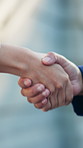 Business, agreement and people with handshake outdoor for urban deal, investment and partnership. Investor, developer and shaking hands in city for development project, collaboration and acquisition