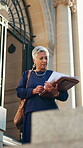 Lawyer, documents and walk with business woman in city for legal aid, review and attorney pride. Case paperwork, courthouse advisory and justice with mature person outdoor for trial and consultant