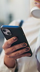 Phone, hands and businesswoman in city with texting, networking or communication on mobile app. Technology, commute and female person with cellphone for online email or contact in urban town.
