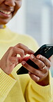 Laugh, scroll and hands in house with phone, online communication and meme post on social media. Happy, digital and black woman in home with tech, internet browse or gif reaction on chat app.
