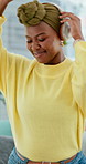 Dance, happy and black woman with headphones in home for streaming audio, playlist and album. Apartment, sofa and person with movement listening to music, radio and track for weekend, relax and chill