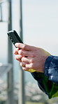 Phone, man and hands of technician by solar panels outdoor with texting, email or feedback for repairs. Technology, typing and male electrician with cellphone for review on app for installation.