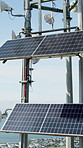 Building, empty and rooftop with solar panels in city for electricity, renewable energy and sustainability. Industrial, outdoor and photovoltaic cell for resources, eco friendly and alternative power