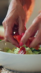 Cooking, woman and salad vegetables in home for healthy recipe, vegetarian diet and nutrition. Food, mature person and fresh ingredients in kitchen for meal preparation, lunch process and vegan dish