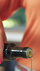 Cooking, kitchen and hands of woman with olive oil for meal prep, lunch and salad dressing. Home, closeup and person pour ingredients for cuisine, culinary skill and recipe for health and nutrition