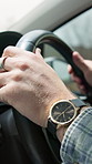 Hands, steering wheel and man with driving in car for travel, road trip or transportation on holiday. Watch, adventure and person in vehicle for journey on vacation, weekend or getaway in countryside