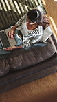 Above, relax and woman on sofa, laptop for entertainment and website for movie. Connection, comfort and person in home, reading for ebook and research for subscription, watching film and technology