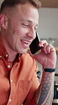 Man, laughing and phone call on break in kitchen, home and communication with contact or discussion. Happy, person and talking with mobile on weekend, humor and funny conversation with technology