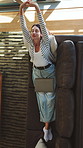 Above, tired and woman on sofa with laptop for remote work with yawn, stretching and done with tasks. Home, freelancer and person on couch close computer for finish, exhausted and break for project