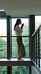 Thinking, balcony and woman with drink in home for inspiration, perspective and start day. Reflection, house and person with beverage for calm, peace and wellness for daydreaming, thoughtful and rest