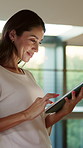 Reading, online and woman with tablet in home, thinking and scroll article with internet connection. Happy, mature person and relax with tech on weekend break, browsing and ebook on website in house