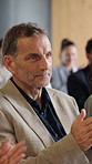 Business, applause and man in seminar, celebration for profit increase and support for stock market. Mature person, audience and employees in workshop, clapping for achievement or success with growth