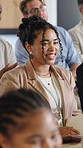 Happy woman, conference and listening with crowd for presentation meeting or workshop in office. Female person, employee or staff training with team or group of colleagues in seminar for speech