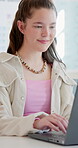 High school, research or student in class with laptop, exam knowledge or internet search for assignment. Education, typing or teenager with tech, learning or information gathering in assessment prep
