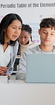 Students, teacher and advice with laptop in classroom for coding, learning and programing. Education, computer and people with explanation for development, conversation and knowledge in highschool