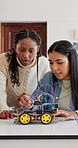 Team, robotics and classroom in school for students, discussion or future development. People, wiring and education with electronics, transportation or machine for knowledge or engineering project