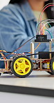 Robotics, classroom and students in school for learning, discussion or future development. Group, people and education with electronics, transportation or machine for knowledge or engineering project