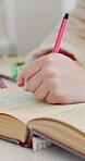 Education, writing and hands of student with sticky note for book annotation, exam study and info. Learner, person and textbook notes in high school for chapter summary, test preparation and learning