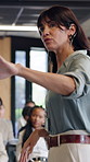 Crowd, coach and back of woman with presentation, business conference and seminar event. Workshop, training and feedback summit with speaker, sales education and audience for career development