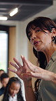Audience, speaker and back of woman with seminar, business conference and presentation event. Workshop, training and feedback summit with coach, sales education and crowd for career development