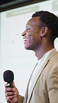 Black man, speaker and projector with microphone on podium for presentation, speech or tradeshow. Businessman, conference and coach with mic for corporate workshop, staff training or work seminar
