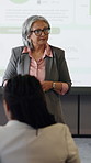 Presentation, question and businesswoman in office for training on finance report with statistics. Graphs, talk and mature female financial manager at corporate seminar for investment proposal.
