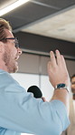 Business, microphone and motivational speaker with man in office for career development speech. Growth, talking and workshop with life coach in professional workplace for employee enrichment