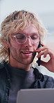 Man, phone call and contact in office with discussion for project management at web design company. Person, laptop and conversation with agreement, review and feedback negotiation at creative agency