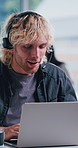 Laptop, talking or man in call center for technical support, network solution or coworking. Customer service, computer or happy person with headset, thinking or internet connection troubleshooting