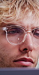 Man, reading and glasses with laptop in office for research, finance report and investigation. Person, eyewear and pc reflection for financial assessment, risk management and compliance information
