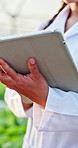 Hands, scientist and tablet in greenhouse for agriculture with checklist, report and inspection for crops. Person, tech and scroll with organic vegetables, sustainability and application at farm