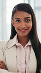 Arms crossed, face and smile of woman lawyer in office for legal aid, council or representation. Confidence, law firm and legislation with happy attorney at agency for court case, hearing or trial