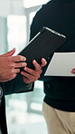 Tablet, documents and hands of business people in office for meeting on finance forecasting for investment. Digital technology, discussion and financial advisors with paperwork for budget prediction.
