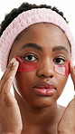 Black woman, face and mask for eyes in studio with beauty, application or serious on white background. African person, portrait and cosmetic product with gel patch, skincare or confidence in Kenya