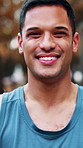 Face, fitness and smile of man outdoor in park for commitment to training or workout routine. Cardio, exercise and health with happy runner in nature for dedication, improvement or wellness activity