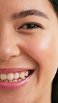 Smile, beauty and half face of woman in studio for skincare, self care and dermatology glow. Aesthetic, shine and facial hydration with portrait of female person for grooming, hygiene and clean
