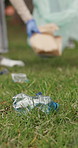Grass, plastic or hands with trash bag for pickup, land pollution or ngo recycling drive for climate action. Park, rubbish or person with eco conservation project, cleanup litter or sustainability