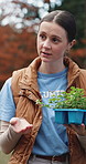 Volunteer, woman and talk in park with plants, sustainability and charity project for ecology growth. Eco friendly, nonprofit and person outdoor with meeting for community garden, discussion or help.