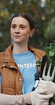 Volunteer, woman and walk outdoor with plants, sustainability or equipment for eco friendly project. Environmentalist, charity and person with tree for community garden, social responsibility or help