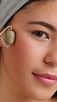 Beauty, jade roller and face of woman in studio for lymphatic drainage, self care or detox. Facial tools, holistic treatment and natural product with female person for circulation and skincare