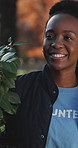 Volunteer, walk and happy woman in park with plants, social responsibility or eco friendly NGO project. Sustainable, charity and black person outdoor with tree for gardening, ecology or conservation.