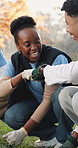 Fist bump, volunteer or people with smile in park, green initiative or environment restoration support. Nature, ngo team or gardening success for reforestation project, sustainability or celebration