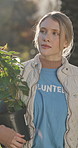 Volunteer, woman and sustainability outdoor with plants, walk or vision for eco friendly NGO project. Environmentalist, charity or person with tree for community garden, social responsibility or help