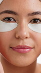 Eye patch, cosmetics and face with woman in studio for self care, beauty or skincare. Collagen benefits, dermatology and aesthetic with closeup of female person for glow, shine and treatment