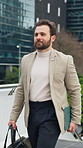 Businessman, walking and outdoor in city with bag, tablet and commute for real estate appointment. Realtor, person and housing agent in urban town with tech, journey and travel to property listing.