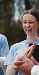 Volunteer, woman and team with applause at park for charity success, outreach goal or laugh. Excited, non profit group and clapping outdoor for NGO milestone, funny celebration or community service