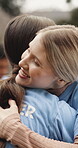 Volunteer, hug or women in park with greeting, support or appreciation in relief campaign. Happiness, love or people outdoor with embrace, friendship connection or thank you in charity project.