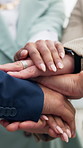 Business people, hands together and meeting with unity for teamwork, company mission or celebration. Diversity, colleagues or group of employees piling with stack for synergy, inclusion or solidarity