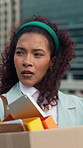 Thinking, business and woman with box in city for travel, work dismissal and department shutdown. Person, walk and cardboard of unemployment, employee resignation and reflection for economic pressure